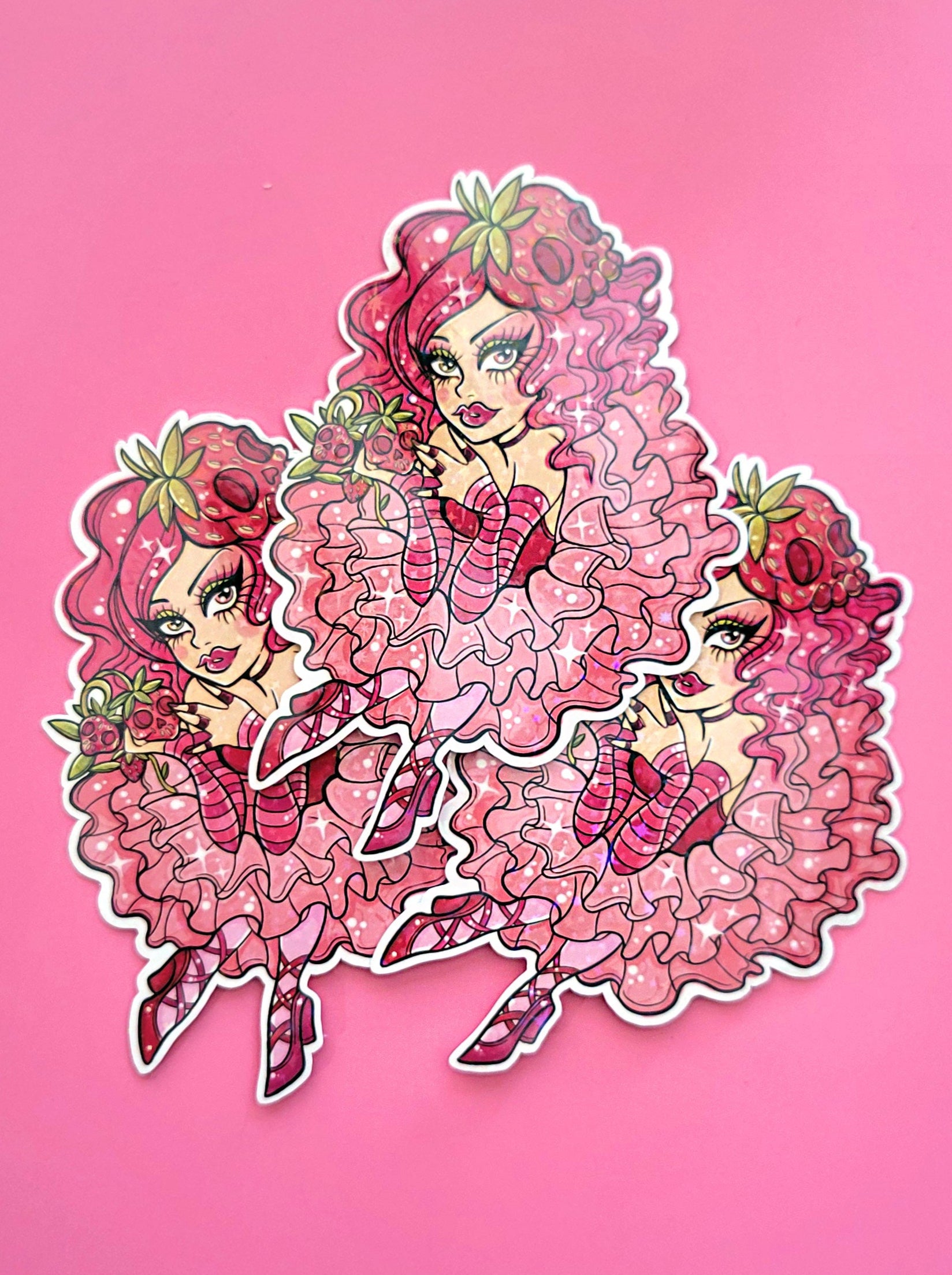 Sticker of a kawaii goth pink haired spooky girl with skulls and strawberries.
