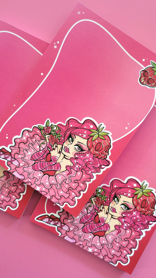 Pink pastel kawaii goth girl spooklette character holding skulls and strawberry on a pink background